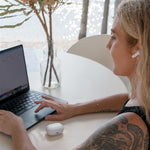 Woman listening to music on her Fuse Airbudz 3 White Noise Cancelling Earbuds